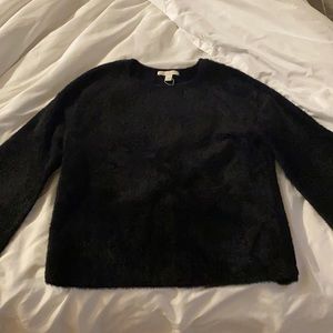 Brand new furry black sweater.   Extremely soft.  Never worn